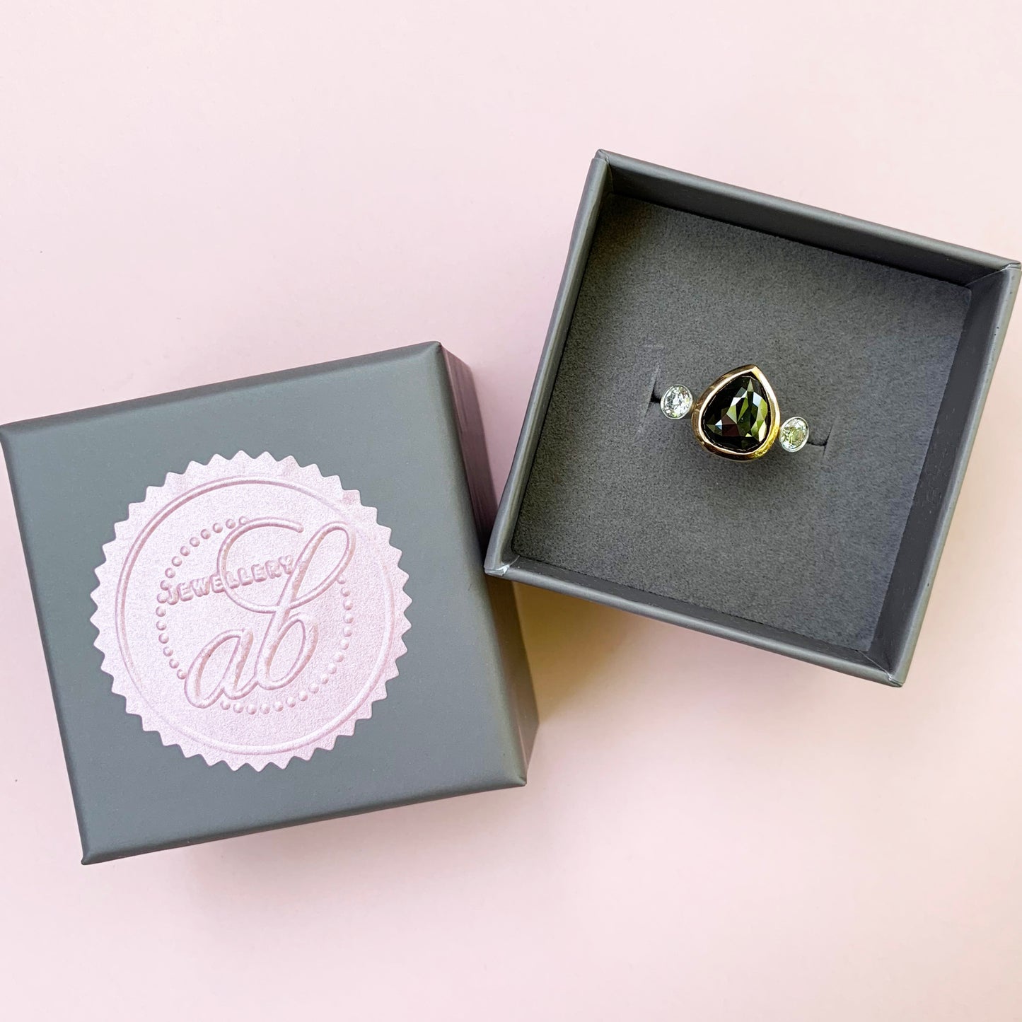 rose cut black diamond ring, 18ct rose gold diamond ring, rose gold ring, black diamond ring with white diamonds either side, black diamond ring, 18ct rose gold diamond ring