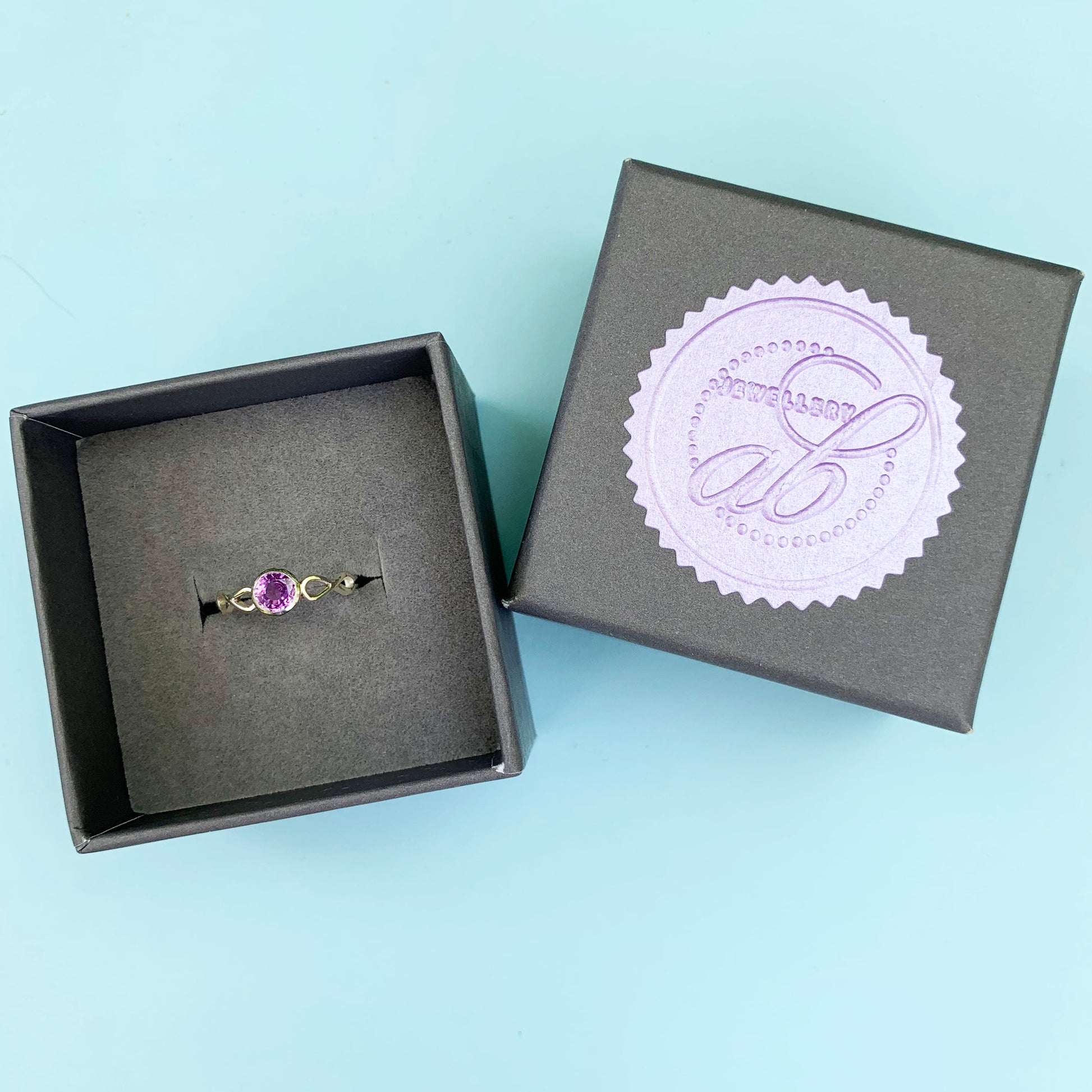 9ct white gold purple sapphire ring, infinite white gold ring, 9ct white gold ring, white gold purple sapphire ring, sapphire ring, gold purple sapphire ring, gold infinite sapphire ring